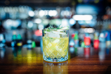 Green Gin Alcoholic Cocktail Drink on the Bar Desk