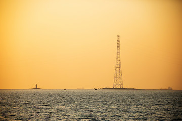Sea facade in the capital of the Far East, the city of Vladivostok. Sea trading port with ships. Drifting ships in the raid.
