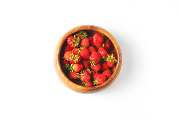 wooden dish with strawberries. white background, view from the top