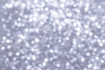 Silver glitter festive background with bokeh lights. Celebration concept for Holidays and anniversary.