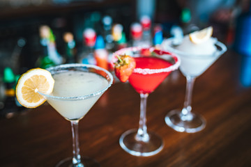 Colorful martini alcoholic drink frozen cocktails on the bar table