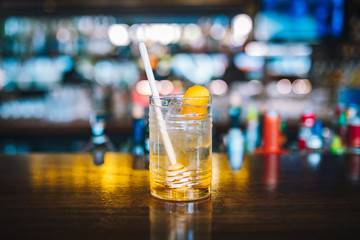 Yellow Alcoholic Cocktail Drink on the Bar Desk