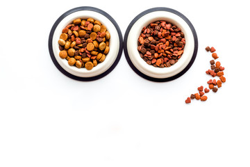 Animal food in bowl on white background top view copy space