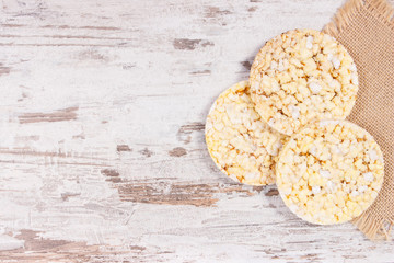 Rice or corn diet bread with chia and oregano for breakfast, healthy nutrition concept, place for inscription