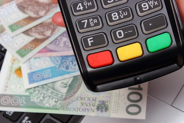Credit card reader with polish currency money, finance concept