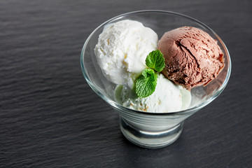 ice cream in glass bowl on slate