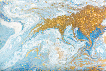 Blue and white marbling pattern with gold glitter. Marble liquid texture.