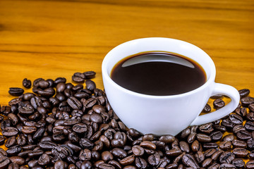 The Coffee Cup With Wooden Background