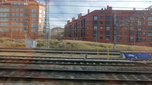 View From The Window Of A Train Of The Buildings Of A City