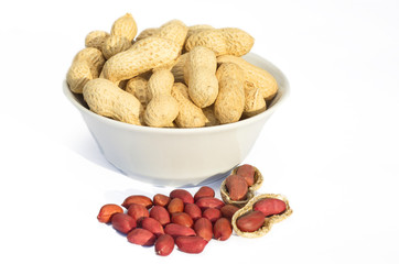 Peanuts in bowl on white background