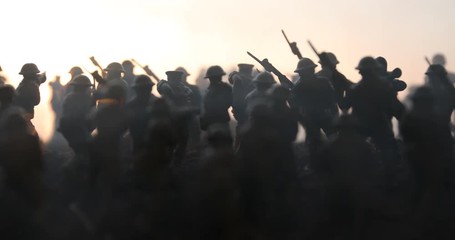 Battle scene. Military silhouettes fighting scene on war fog sky background. World War Soldiers Silhouettes Below Cloudy Skyline At sunset. Artwork Decoration. Selective focus