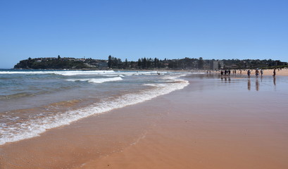 Sydney, Australia - Feb 3, 2019. People relaxing at the beach on a hot sunday in summer time. Dee Why beach, Sydney, NSW, Australia.
