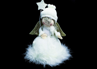 Blond fairy doll with star in the hands for christmas tree 