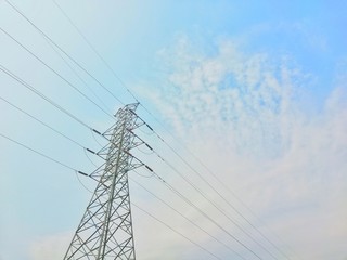 Fototapeta premium High voltage tower with sky background and free space for your message or website.