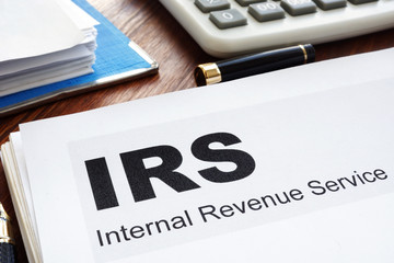 IRS Internal Revenue Service documents and folder. - obrazy, fototapety, plakaty