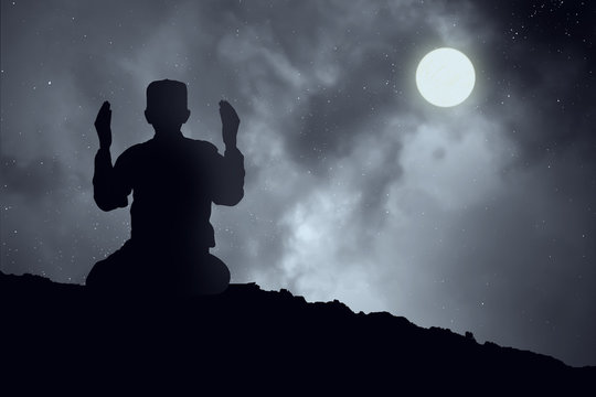 Silhouettes Muslim prayer,the light of faith, hope, faith, supplication,Concept of Islam is the religion, Young Muslim man praying mosque blurred background - Image 