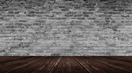 background of an empty white room, a cellar, lit by a searchlight. Brick white wall and wooden floor
