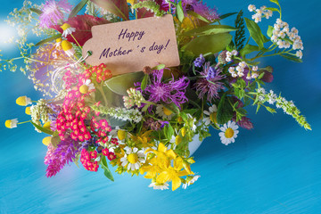 Mothers day message on a selfmade bouquet of garden flowers