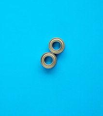 two small rolling ball bearings closed with metal