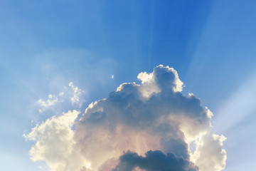 Fototapeta na wymiar light rays explosion on clear blue sky with cloud