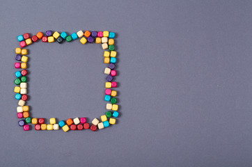 Wooden color beads composition. Needlework concept background. Flat lay