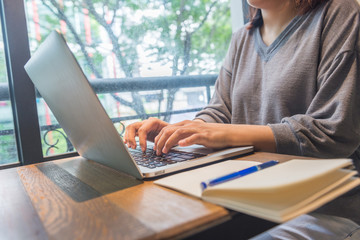 Fototapeta premium Asian woman freelancer working on laptop computer