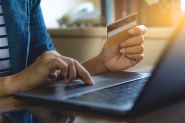 Business woman work on laptop, online shopping by credit card.