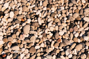 Pebbles and stones from beach background pattern