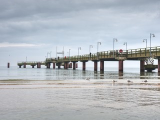 Fototapeta premium Traditional wooded bridge pier with nobody against sky