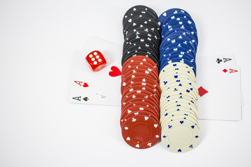 Four aces with chips and poker dice.