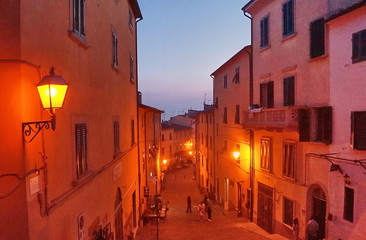 Typical street at sunset of the village of Castagneto Carducci, Tuscany, Italy