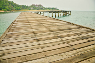Wooden pier lead into the sea