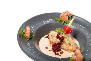 fish fillet with sauce baked and decorated