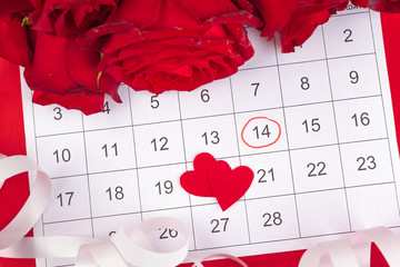 February 14 on calendar and decorations for Valentine's Day.