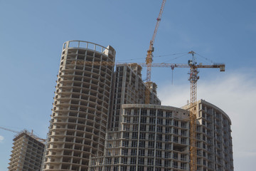 Fototapeta na wymiar Crane and building construction. big building construction