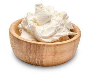 Traditional Mascarpone cheese in wooden bowl isolated with clipping path