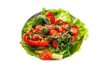 Closeup plate of fresh vegetables salad with tomatoes, corn, beans, pepper and parsley isolated at white background.