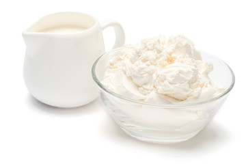 Traditional Mascarpone cheese and cream or milk isolated with clipping path