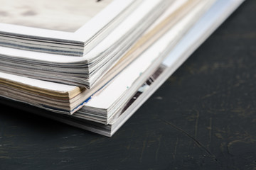 Close up stacking magazine place on table background