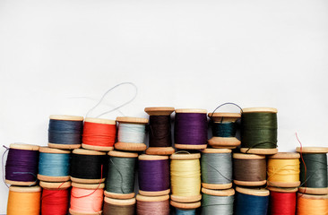 Sewing thread colored on white background