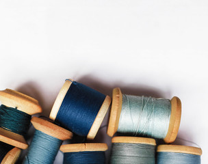 Sewing thread blue on white background