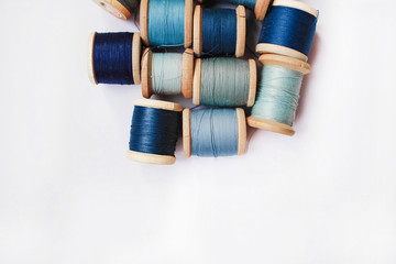 Sewing thread blue on white background
