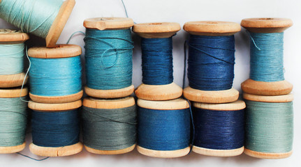 Sewing thread blue on white background