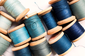 Sewing thread blue on white background