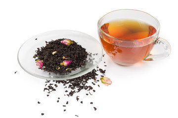 Cup of black tea, tea leaves with chinese rose buds