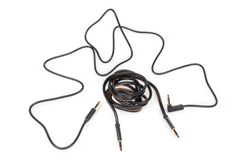 Analog audio cables with mini stereo connectors on white background