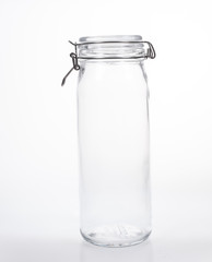 Glass jar with lid on white background
