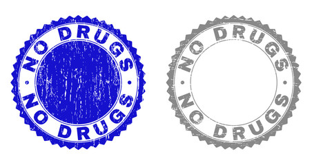 Grunge NO DRUGS stamp seals isolated on a white background. Rosette seals with grunge texture in blue and grey colors. Vector rubber stamp imitation of NO DRUGS label inside round rosette.
