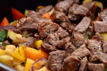 Beef stew with potatoes, carrots and sweet peppers.