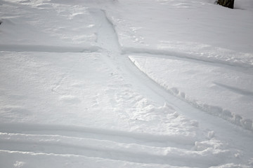 Panoramic view of a snowy slope on a cold winter day.